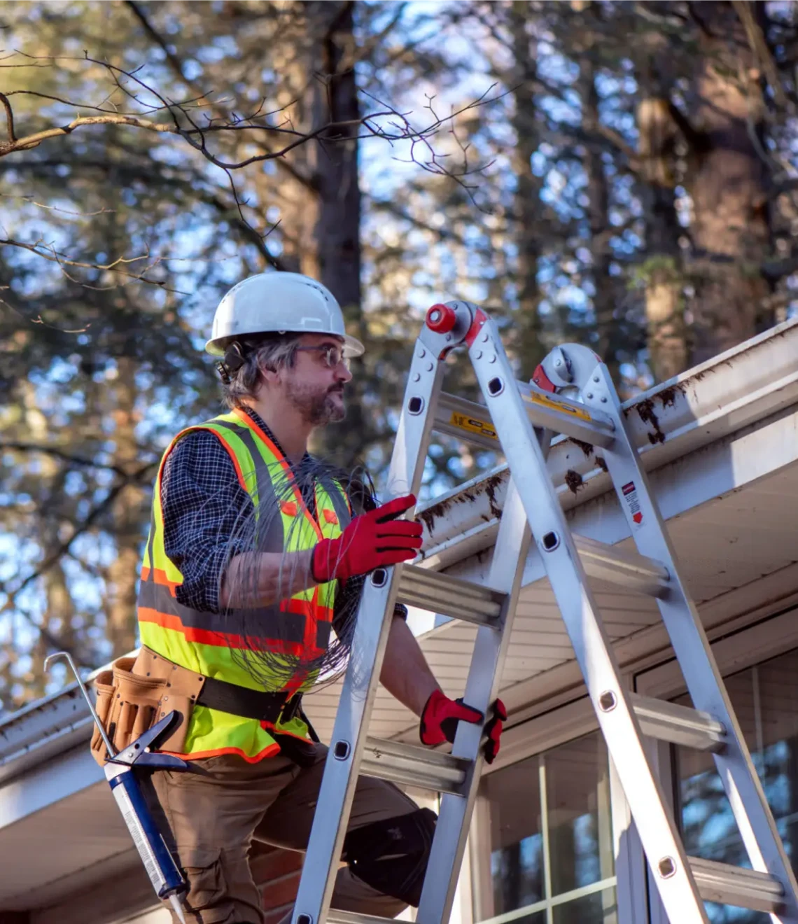 Man in hard hat on ladder